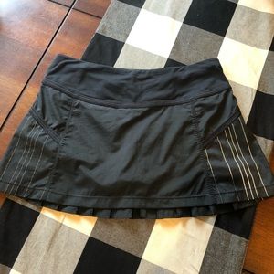 Lululemon Black Tennis Skirt w/ bikers. Size 6
